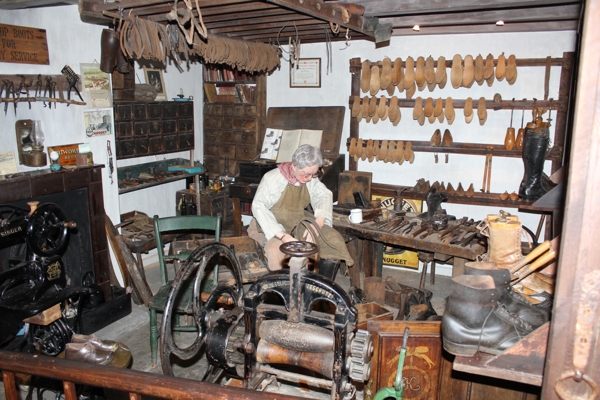 Interior of Nidderdale Museum. Cobbler's workshop, sewing machine, mangle, and other tools