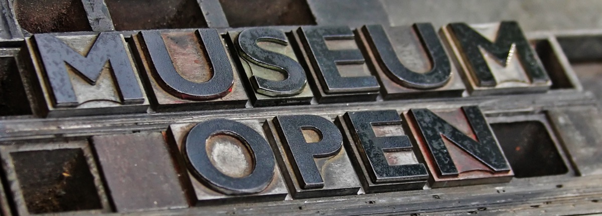 The words Museum Open formed from letterpress type